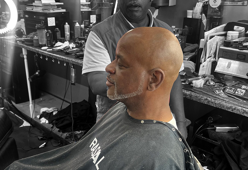 "a picture of an older black man with razor sharp edge-up"